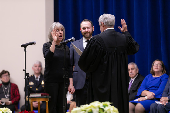 Sheila Rutledge takes the oath of office for County Board member.