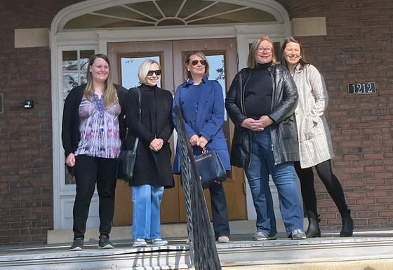 Board members standing in front of 1212 Larkin