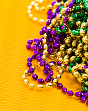 Yellow, green, and purple Mardi Gras beaded necklaces