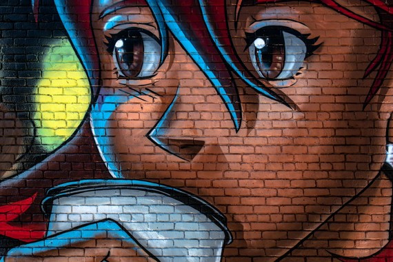 Anime character on a brick wall done with spray paint
