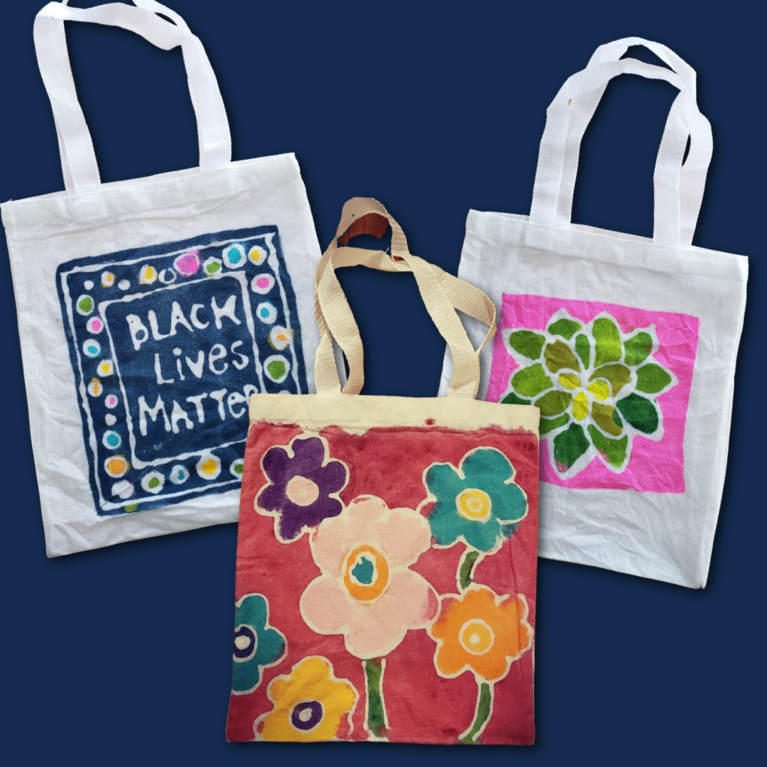 examples of tote bags with different designs including black lives matter and flowers