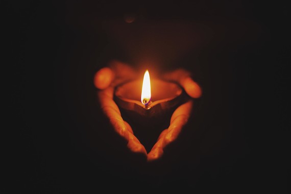 hands holding a candle