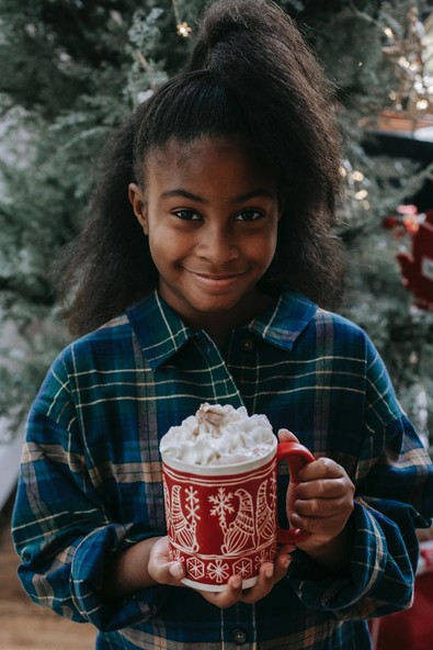child with hot chocolate
