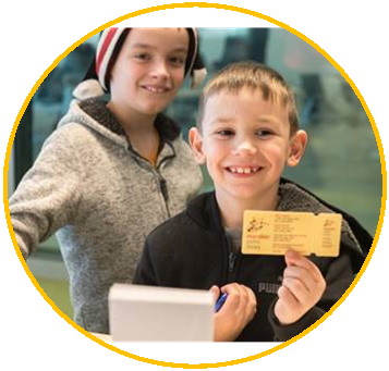 Two boys smiling with Library card