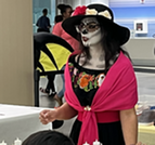 woman dressed in costume for Dia de lost Muertos