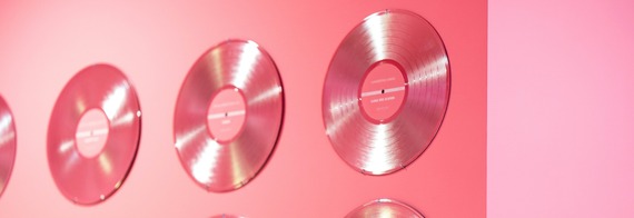 pink records hanging on the wall