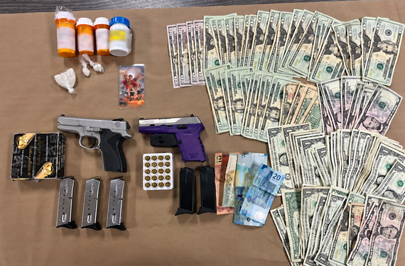 Recovered guns, drugs, ammunition, and cash from Sept. 3 arrest of A. Riley