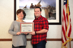 Mary Ellen Vanderventer accepts Seven Seals Award from Andrew Tangen