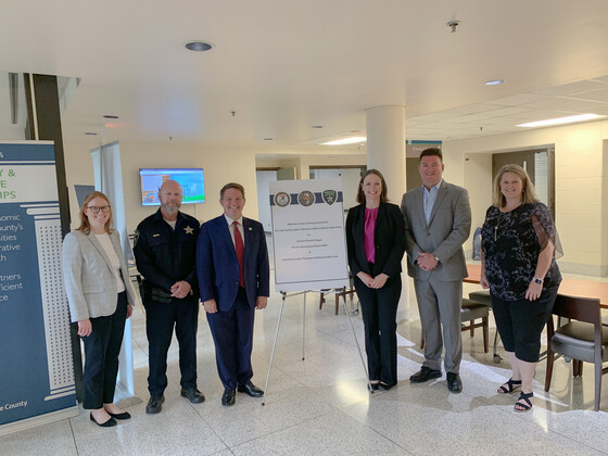 6 people all standing side by side 