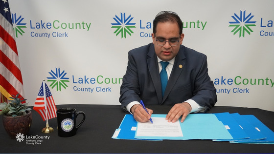 Lake County Clerk Anthony Vega signing the General Primary Election results on April 6th making them official