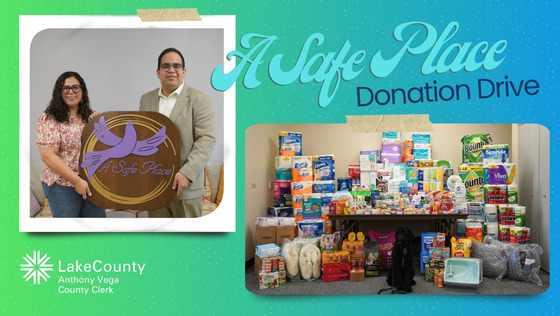 Clerk Vega holding a safe place sign with employee from organization, and the service dog eddy with all the donations
