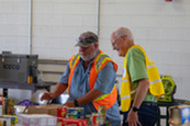 Volunteers sorting donations at Operation Dropbox