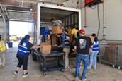 Volunteers loading donations on to a truck