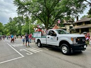 Village Board paricipating in 2024 July 4 parade