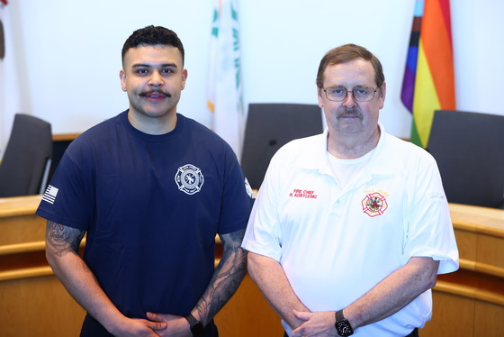 Xavier Rendon with Fire Chief Ron Kobyleski after being sworn in as a Firefighter/Paramedic