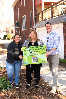National Community Development Week signs being placed around Oak Park.