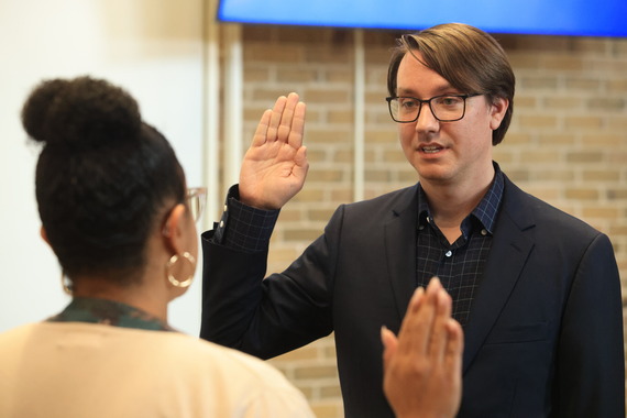 Derek Eder is sworn in by Village Clerk Christina M. Waters on June 17, 2025