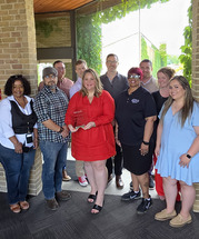 Village staff poses with the John A Sasso Award