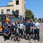 Volunteer Eddie Stitzman with members of the Oak Park Fire Department