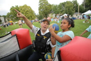 Sergeant Episcopo with a kid during National Night Out event in 2023