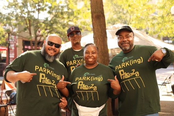 Parking Services employees at the 2025 Park(ing) Palooza Park(ing) Day event