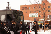 Fenwick football players board the bus to the Class 6A state championship game on Dec. 2