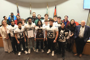 Fenwick football team receiving proclamation at Village Board meeting on Dec. 9, 2025