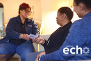 ECHO team visits a senior with ECHO logo