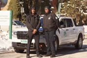 Parking Enforcement Officers Karlos Curry and Mekhi Moss outside Village Hall.