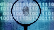 Crime data graphic - fingerprint overlay over computer screen