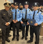 Deputy Chief Roderick Robinson with Officers Maliek Wade, Shane Fessenden and Anthony Ponce at their Police Academy graduation ceremony.