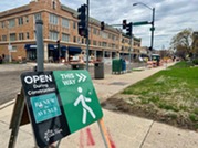 Sign directing pedestrians to businesses along Oak Park Avenue during Renew the Avenue construction project