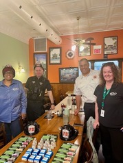 Kim Smith, Officer Raphael Murphy, Fire Chief JT Terry and Mary Naughton at E.C.H.O. Exchange