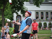 A juggler performs at the Oak Park July 4 parade