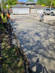 Concrete pavement is installed at the site of an alley sewer improvement