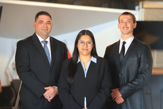 Police Officers Jose Oliveras, Amy Carro-Luna and Remingijus Ivanovas after their swearing-in ceremony on April 30, 2026