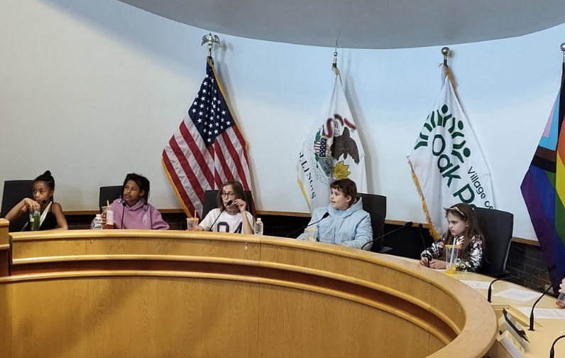 Kids participate in a youth mock government meeting at the Civic Engagement Festival on May 3 at Village Hall.