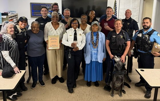 Residents of Mills Park Tower and members of the Oak Park Police Department stand together