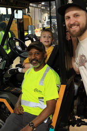 Equipment Operator Derrick Breland with community members at the Public Works Department's Touch-a-Truck event on May 19, 2026