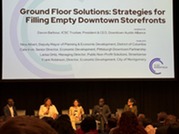 Panelists speak during the ICSC in Las Vegas