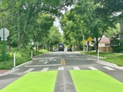 A speed cushion on Thomas Street along the Village's Neighborhood Greenway Network