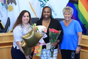Takeshi Thompson (center) with Noemy Diaz (left) and Dawn Skoda after Thompson was sworn into her Business License Officer position.