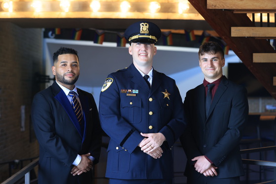 Patrol Officer Efron Ramon, Commander Michael Lambert and Patrol Officer Antoni Turek after being sworn in Monday, June 29.