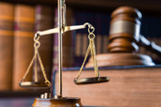 Court ruling graphic with scale, gavel