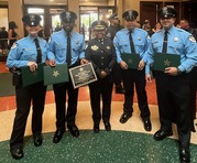 Abigail Jones, Tyrin Bates, Margarito Ramos and Austin Romero with Chief Shatonya Johnson after graduating from the police academy.