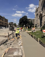 Sidewalk base concrete is poured along Oak Park Avenue as part of the Renew the Avenue project.