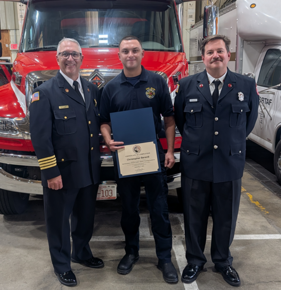 Chris Berardi celebrates his graduation from the NIPSTA alongside Deputy Chief Kevin Fadden and Lietenant Steve Ausmann