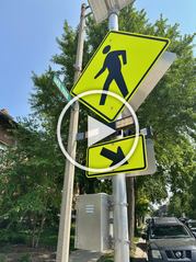 RRFB sign in Oak Park with play button