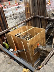 AT&T rebuilding a manhole on Oak Park Avenue during the Renew the Avenue construction project.