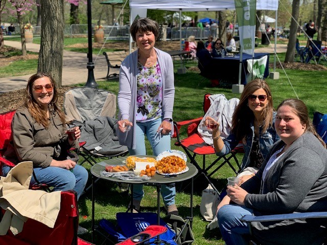 Women with wine picnic on spring day